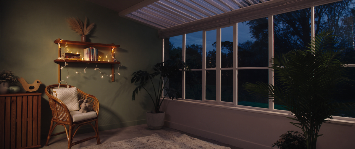 CuddleFlora homepage banner - cozy conservatory at dusk
